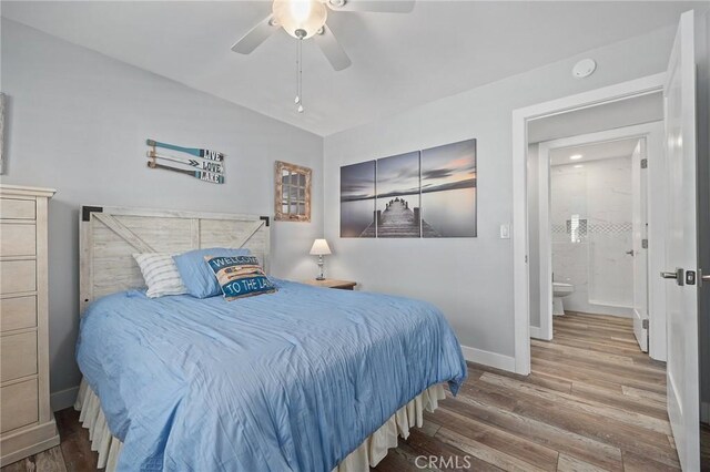 22244 Treasure Island Dr Unit 5, Canyon Lake, CA 92587 - bedroom with baseboards, wood finished floors, vaulted ceiling, and ceiling fan