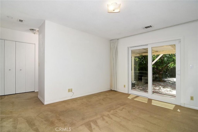 unfurnished bedroom with access to outside, carpet flooring, and baseboards