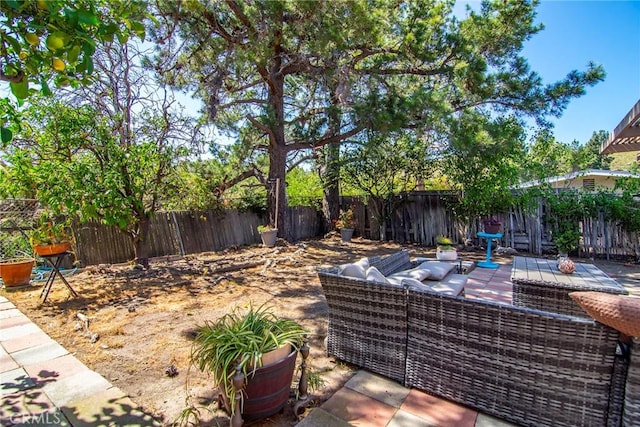 view of patio featuring a fenced backyard and an outdoor living space