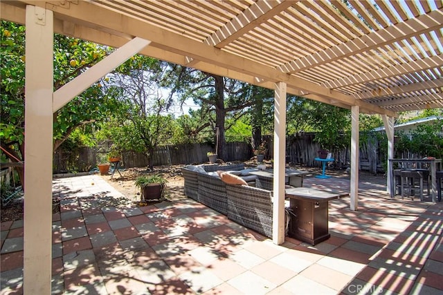 view of patio featuring outdoor lounge area, a fenced backyard, a pergola, and outdoor dining space