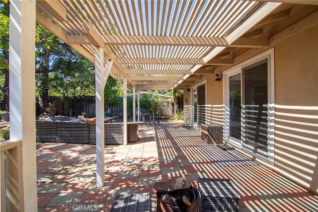 view of patio featuring a pergola, a fenced backyard, and an outdoor hangout area