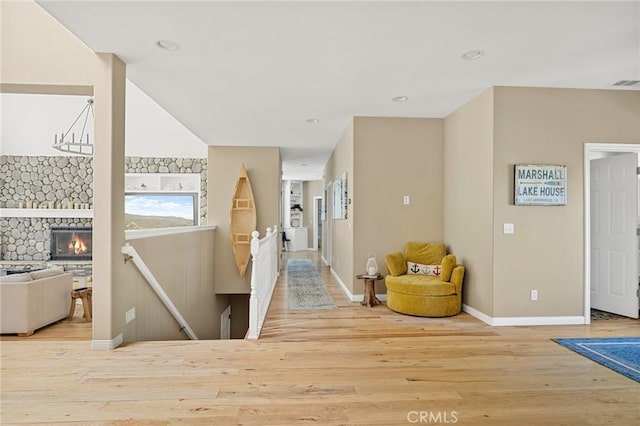 28537 N Shore Rd, Lake Arrowhead, CA 92352 - hall with wood finished floors, an upstairs landing, and baseboards