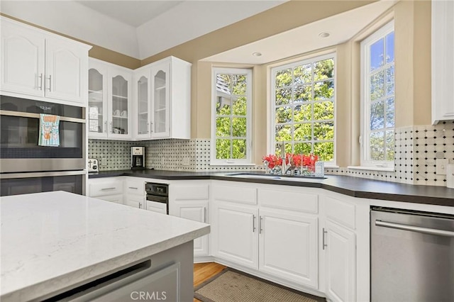 28537 N Shore Rd, Lake Arrowhead, CA 92352 - kitchen with appliances with stainless steel finishes, a sink, healthy amount of natural light, and backsplash