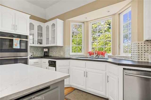 28537 N Shore Rd, Lake Arrowhead, CA 92352 - kitchen with stainless steel appliances, healthy amount of natural light, and tasteful backsplash