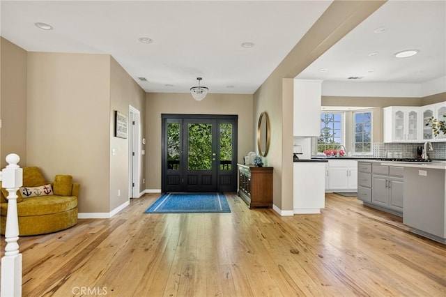 28537 N Shore Rd, Lake Arrowhead, CA 92352 - entryway featuring light wood-style flooring, baseboards, and recessed lighting