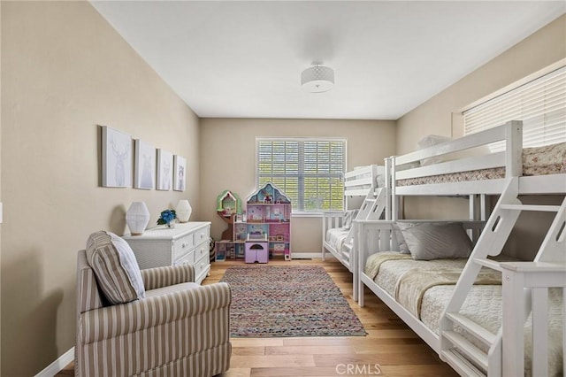 28537 N Shore Rd, Lake Arrowhead, CA 92352 - bedroom with baseboards and wood finished floors