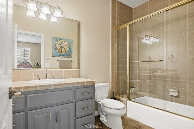 28537 N Shore Rd, Lake Arrowhead, CA 92352 - bathroom featuring toilet, vanity, combined bath / shower with glass door, and tile patterned floors