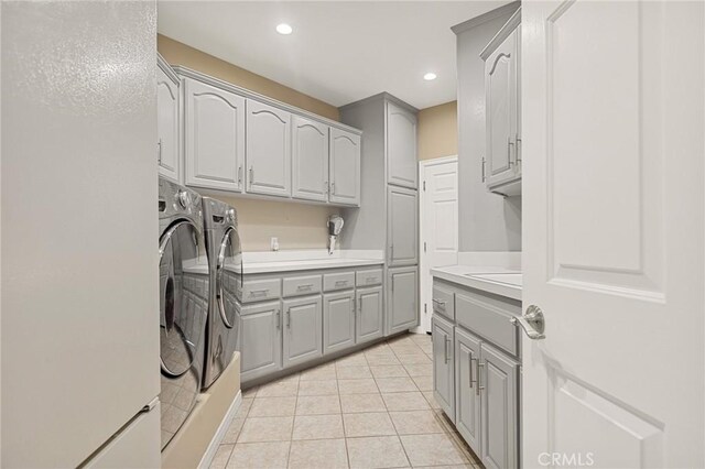 28537 N Shore Rd, Lake Arrowhead, CA 92352 - laundry room with cabinet space, independent washer and dryer, light tile patterned floors, and recessed lighting