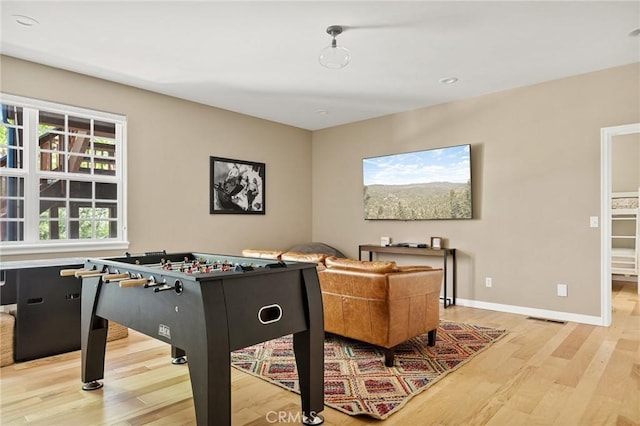 28537 N Shore Rd, Lake Arrowhead, CA 92352 - rec room with light wood-type flooring and baseboards