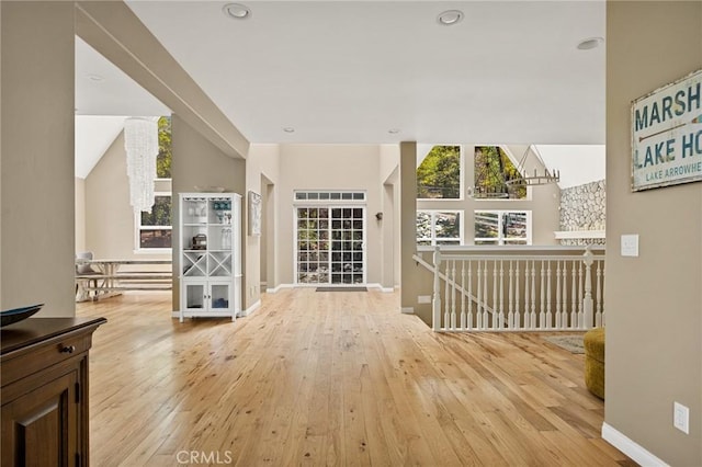 28537 N Shore Rd, Lake Arrowhead, CA 92352 - hallway with wood-type flooring, baseboards, recessed lighting, an upstairs landing, and lofted ceiling