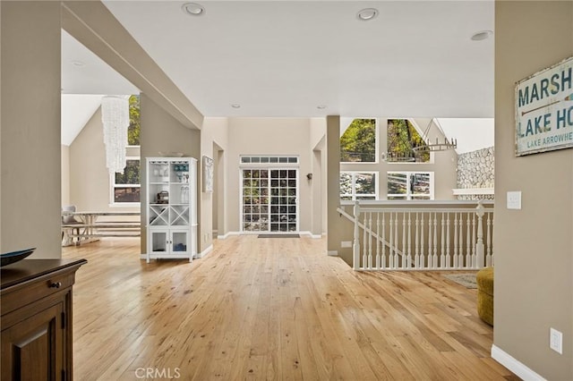 28537 N Shore Rd, Lake Arrowhead, CA 92352 - hallway with wood-type flooring, recessed lighting, an upstairs landing, and vaulted ceiling