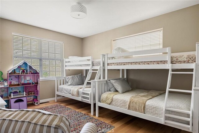 28537 N Shore Rd, Lake Arrowhead, CA 92352 - bedroom featuring wood finished floors and baseboards
