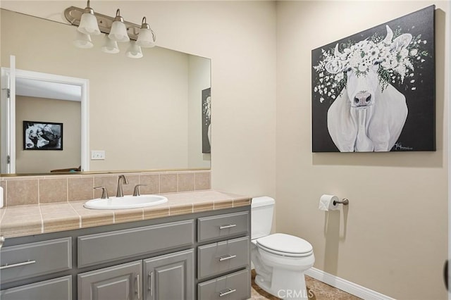 28537 N Shore Rd, Lake Arrowhead, CA 92352 - bathroom featuring toilet, vanity, and baseboards