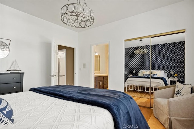 28537 N Shore Rd, Lake Arrowhead, CA 92352 - bedroom featuring wood finished floors and connected bathroom