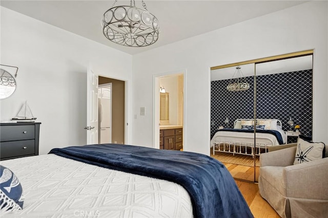 28537 N Shore Rd, Lake Arrowhead, CA 92352 - bedroom with wood finished floors and ensuite bathroom