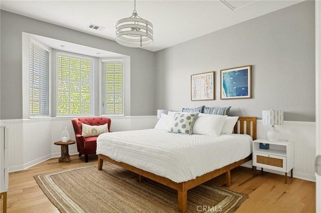 28537 N Shore Rd, Lake Arrowhead, CA 92352 - bedroom with a wainscoted wall and light wood finished floors