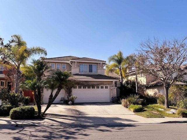 11610 Wills Creek Rd, San Diego, CA 92131 - traditional-style home featuring concrete driveway, an attached garage, stucco siding, and a tile roof