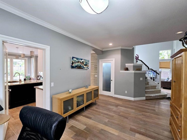 11610 Wills Creek Rd, San Diego, CA 92131 - foyer with stairs, healthy amount of natural light, crown molding, wood finished floors, and baseboards