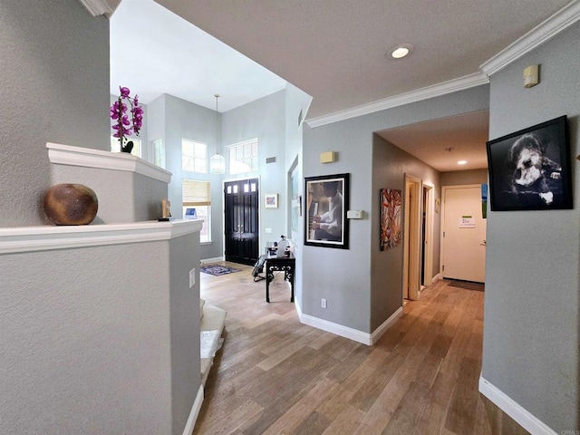 11610 Wills Creek Rd, San Diego, CA 92131 - corridor with wood finished floors, crown molding, baseboards, and recessed lighting