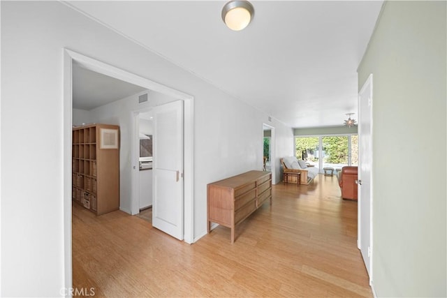16851 Morse Cir, Huntington Beach, CA 92649 - corridor with light wood finished floors and baseboards