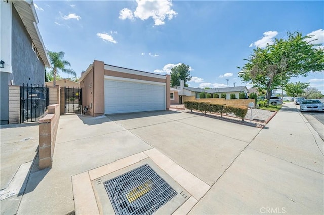 19508 Springport Dr, Rowland Heights, CA 91748 - view of front of property featuring a gate, stucco siding, and a detached garage