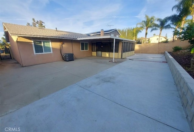 19508 Springport Dr, Rowland Heights, CA 91748 - back of house with a fenced backyard, central AC unit, stucco siding, a patio area, and a sunroom