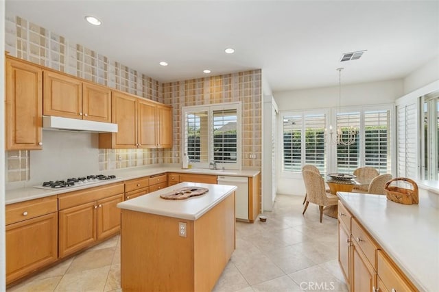 75929 Camino Cielo, Indian Wells, CA 92210 - kitchen with white appliances, under cabinet range hood, light countertops, light tile patterned flooring, and recessed lighting