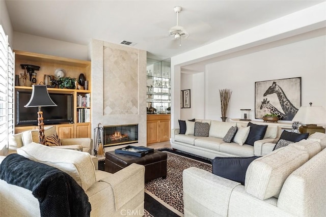 75929 Camino Cielo, Indian Wells, CA 92210 - living area with a tiled fireplace and a ceiling fan