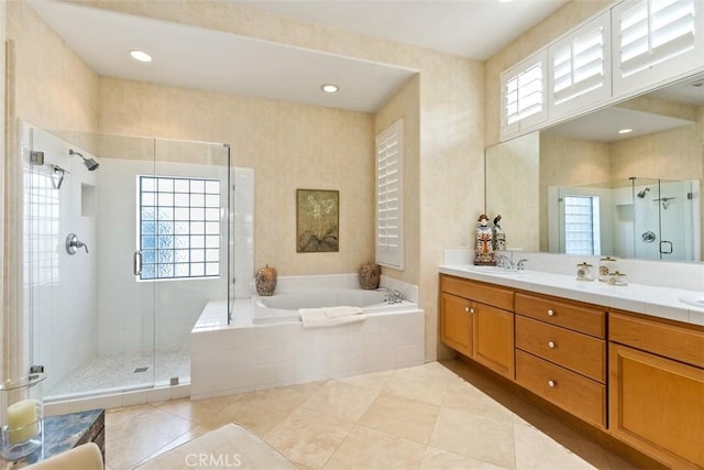 75929 Camino Cielo, Indian Wells, CA 92210 - bathroom featuring a garden tub, a shower stall, double vanity, and tile patterned flooring