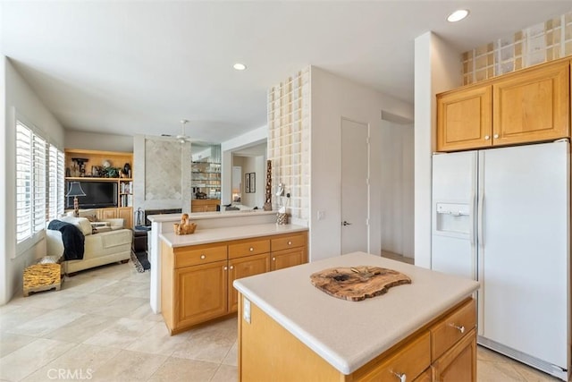 75929 Camino Cielo, Indian Wells, CA 92210 - kitchen with white refrigerator with ice dispenser, open floor plan, ceiling fan, light countertops, and recessed lighting