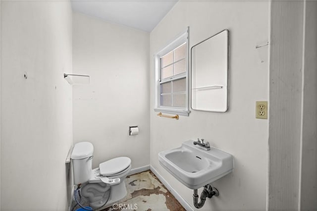 1506 W 5th St, San Pedro, CA 90732 - bathroom with toilet, a sink, and baseboards
