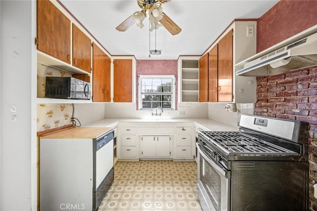 1506 W 5th St, San Pedro, CA 90732 - kitchen with gas stove, black microwave, a ceiling fan, under cabinet range hood, and light countertops