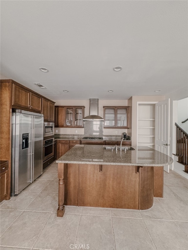 13529 Scarlet Sage Trl, San Diego, CA 92130 - kitchen with stainless steel appliances, wall chimney range hood, a sink, light stone countertops, and recessed lighting