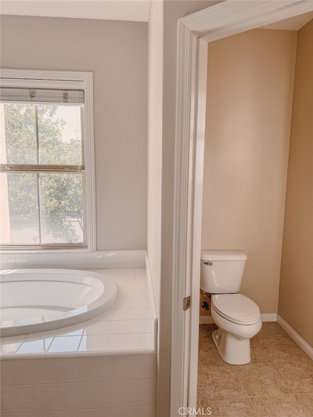 13529 Scarlet Sage Trl, San Diego, CA 92130 - bathroom with toilet, a garden tub, baseboards, and tile patterned floors