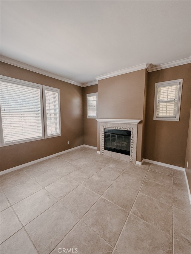13529 Scarlet Sage Trl, San Diego, CA 92130 - unfurnished living room with ornamental molding, a tile fireplace, light tile patterned floors, healthy amount of natural light, and baseboards