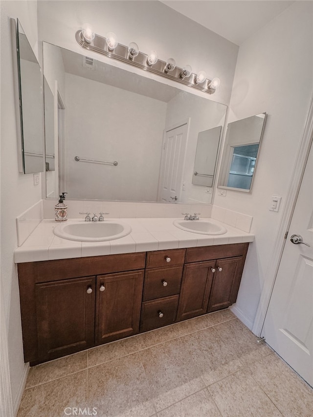 13529 Scarlet Sage Trl, San Diego, CA 92130 - full bath featuring double vanity and baseboards