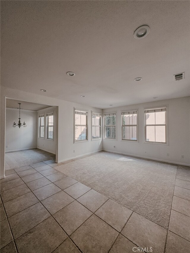 13529 Scarlet Sage Trl, San Diego, CA 92130 - tiled empty room featuring carpet, baseboards, a textured ceiling, and recessed lighting