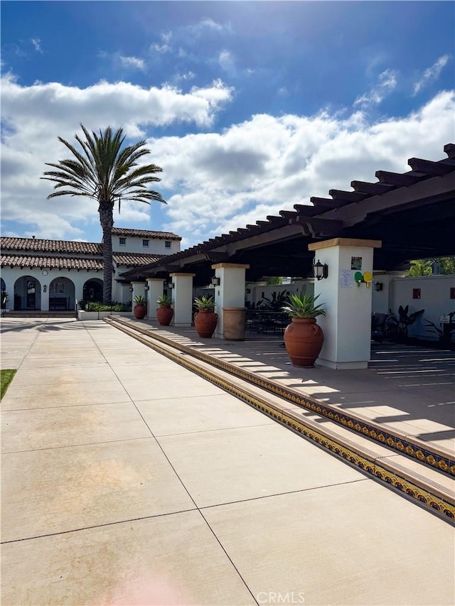 13529 Scarlet Sage Trl, San Diego, CA 92130 - view of front of home with stucco siding and a pergola