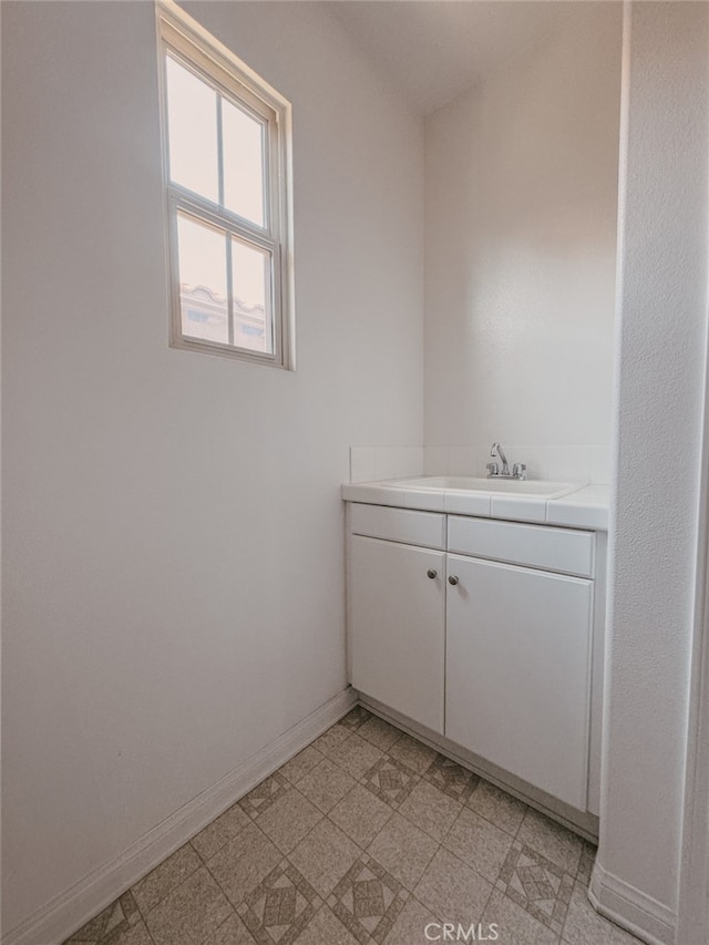13529 Scarlet Sage Trl, San Diego, CA 92130 - bathroom featuring vanity, baseboards, and tile patterned floors