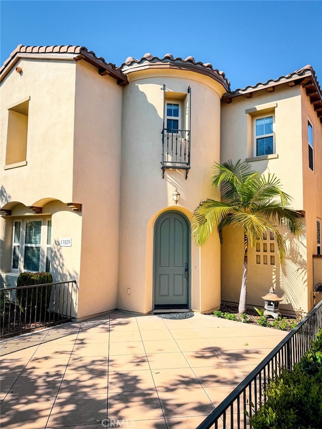 13529 Scarlet Sage Trl, San Diego, CA 92130 - mediterranean / spanish-style home with stucco siding, fence, and a tiled roof