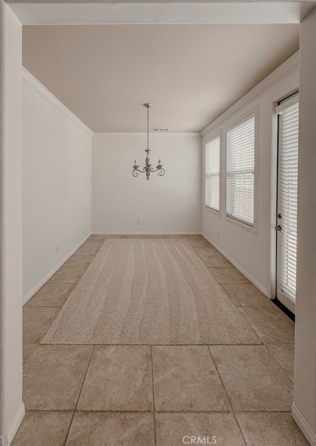 13529 Scarlet Sage Trl, San Diego, CA 92130 - unfurnished dining area with a chandelier, light tile patterned floors, light colored carpet, baseboards, and ornamental molding