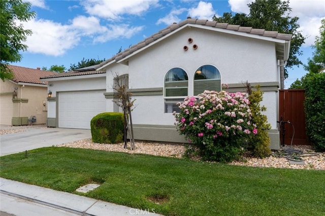 3008 La Vina Cir, Los Banos, CA 93635 - view of front of property with a garage, driveway, stucco siding, and a tile roof