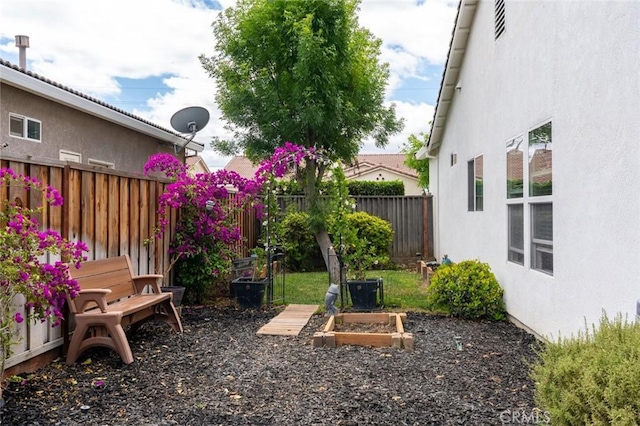 3008 La Vina Cir, Los Banos, CA 93635 - view of yard with fence and a vegetable garden