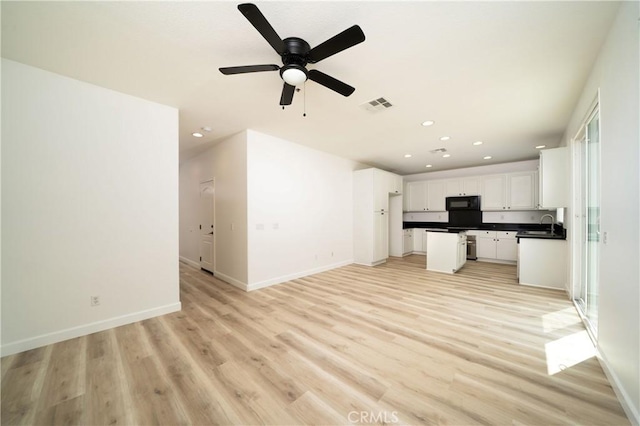 8063 Cambria Cir, Stanton, CA 90680 - unfurnished living room with recessed lighting, light wood-type flooring, ceiling fan, baseboards, and a sink