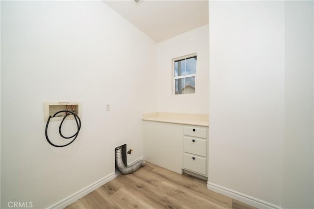 8063 Cambria Cir, Stanton, CA 90680 - clothes washing area with light wood-style flooring, hookup for a washing machine, and baseboards