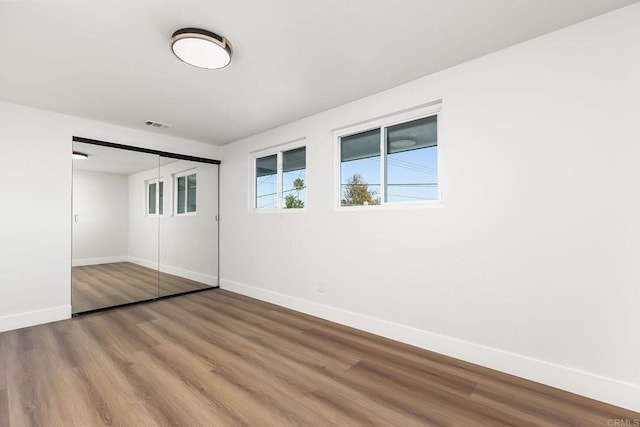 6802 Maury Dr, San Diego, CA 92119 - unfurnished bedroom featuring baseboards, wood finished floors, and a closet