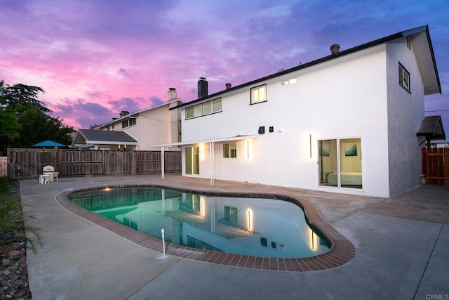 6802 Maury Dr, San Diego, CA 92119 - pool at dusk with a patio and a fenced backyard