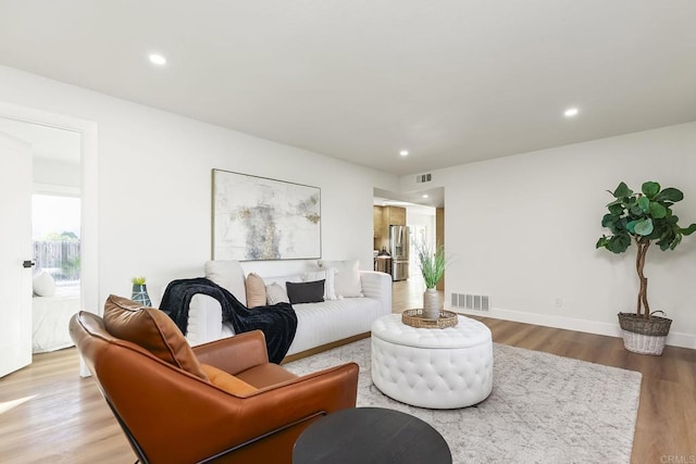 6802 Maury Dr, San Diego, CA 92119 - living area with wood finished floors, recessed lighting, and baseboards