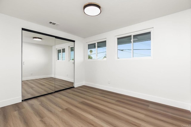 6802 Maury Dr, San Diego, CA 92119 - unfurnished bedroom featuring wood finished floors, baseboards, and a closet