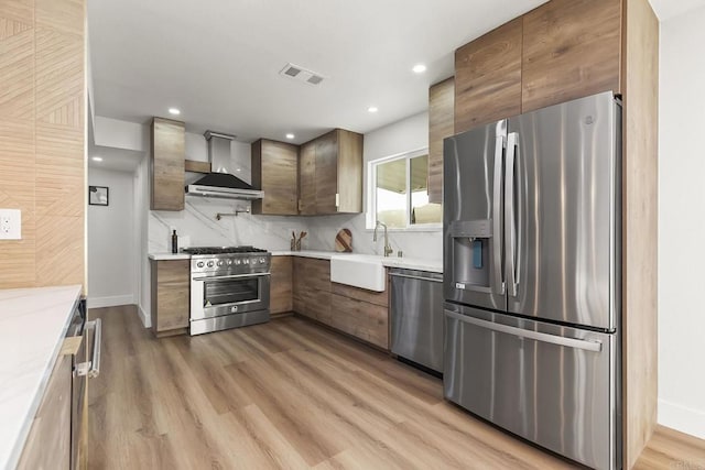6802 Maury Dr, San Diego, CA 92119 - kitchen featuring stainless steel appliances, wall chimney exhaust hood, a sink, light countertops, and recessed lighting